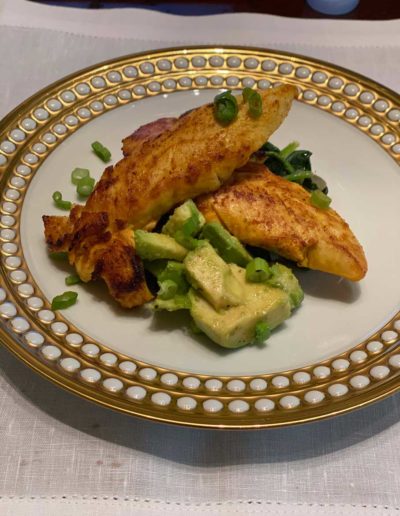 Fish and avocado on a plate