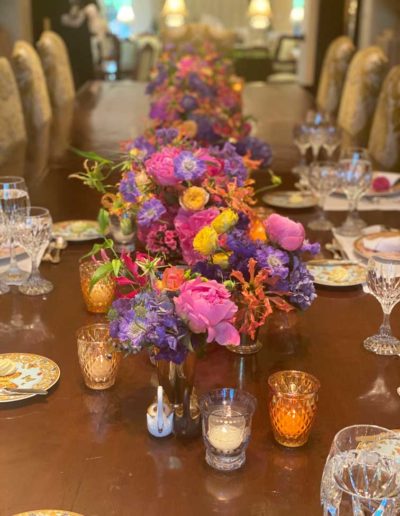 An elegant dining table with bright flowers
