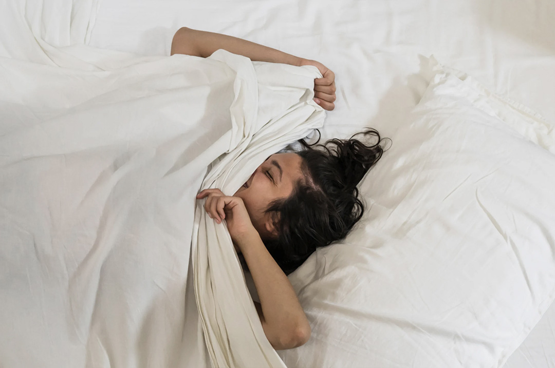 What It Actually Means If You Move Around A Lot While Sleeping